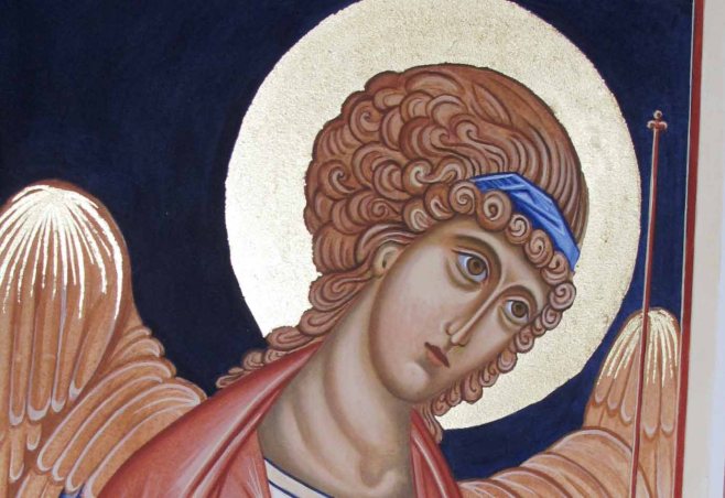 Applying gold leaf to the halo and wings