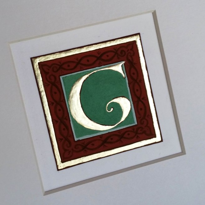 Gilded letter G from Avranches